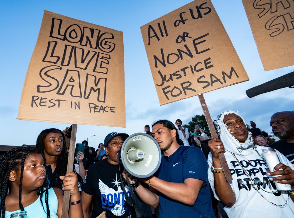 Maria Hamilton, mother of Dontre Hamilton, makes remarks at a vigil for Samuel Sharpe Jr., held by the Milwaukee Alliance Against Racist and Political Repression, on Tuesday at King Park in Milwaukee, Dontre Hamilton was killed in an encounter with Milwaukee police in 2014.