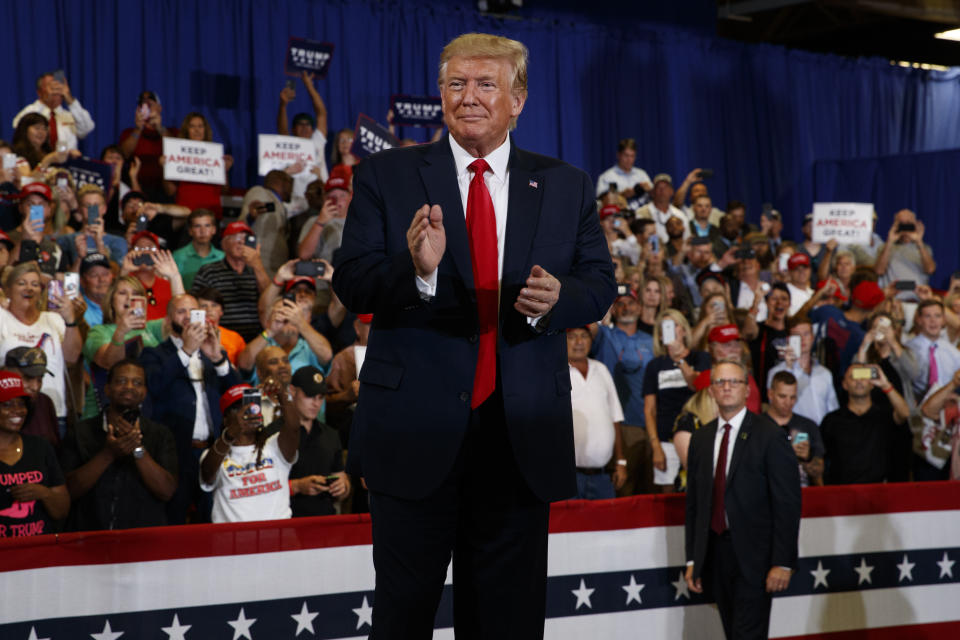 President Donald Trump arrives on stage at the Crown Expo for a campaign rally, Monday, Sept. 9, 2019, in Fayetteville, N.C. (AP Photo/Evan Vucci)