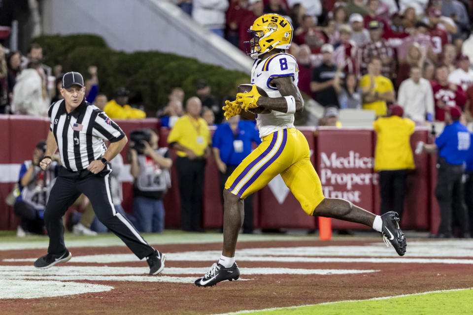 LSU wide receiver Malik Nabers (8) scores a touchdown against Alabama during the first half of an NCAA college football game, Saturday, Nov. 4, 2023, in Tuscaloosa, Ala. (AP Photo/Vasha Hunt)