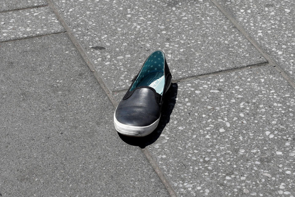 <p>A shoe lies o the sidewalk in Times Square after a speeding vehicle struck pedestrians on the sidewalk in New York City on May 18, 2017. (Mike Segar/Reuters) </p>