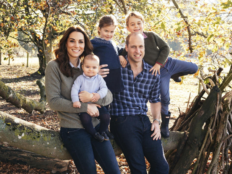 This photo released by Kensington Palace on Friday Dec. 14, 2018, shows the photo taken by Matt Porteous of Britain's Prince William and Kate, Duchess of Cambridge with their children Prince George, right, Princess Charlotte, center, and Prince Louis at Anmer Hall in Norfolk, east England, which is to be used as their 2018 Christmas card. (Matt Porteous/Kensington Palace via AP)