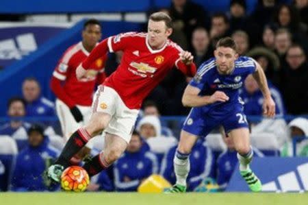 Football Soccer - Chelsea v Manchester United - Barclays Premier League - Stamford Bridge - 7/2/16 Chelsea's Gary Cahill and Manchester United's Wayne Rooney in action Reuters / Stefan Wermuth Livepic EDITORIAL USE ONLY. No use with unauthorized audio, video, data, fixture lists, club/league logos or "live" services. Online in-match use limited to 45 images, no video emulation. No use in betting, games or single club/league/player publications. Please contact your account representative for further details.