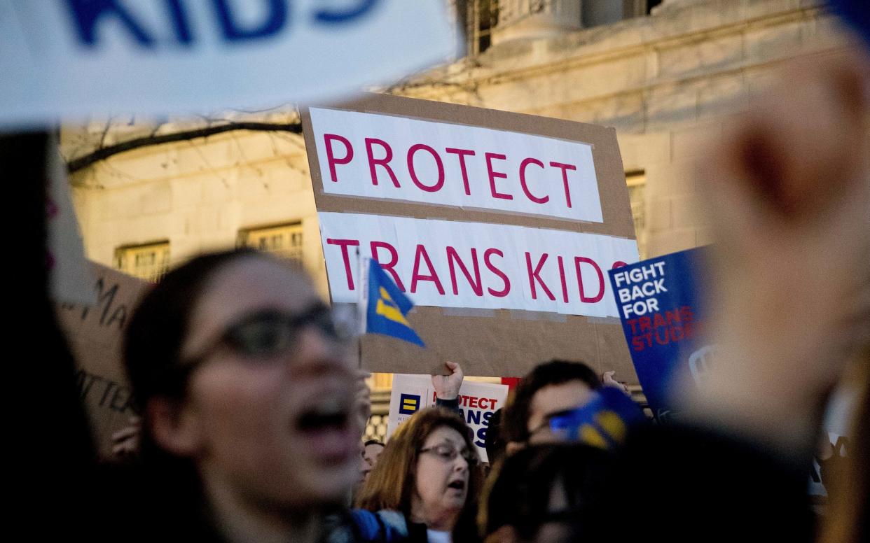 Activists and protesters with the National Center for Transgender Equality rally in front of the White House, Feb 2017 - Copyright 2017 The Associated Press. All rights reserved.