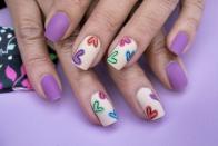 <p>Who says Valentine's Day is only about red and pink? This design pairs fun hearts with matte purple polish.</p>