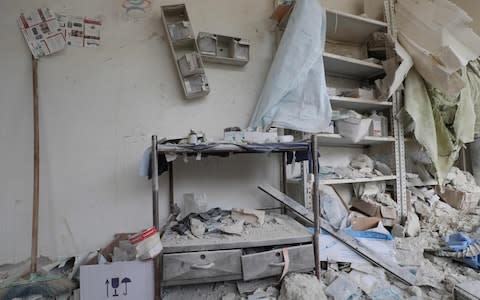 A medical room covered in rubble and debris following reported shelling by the Syrian government in the town of Hbeit - Credit: AFP