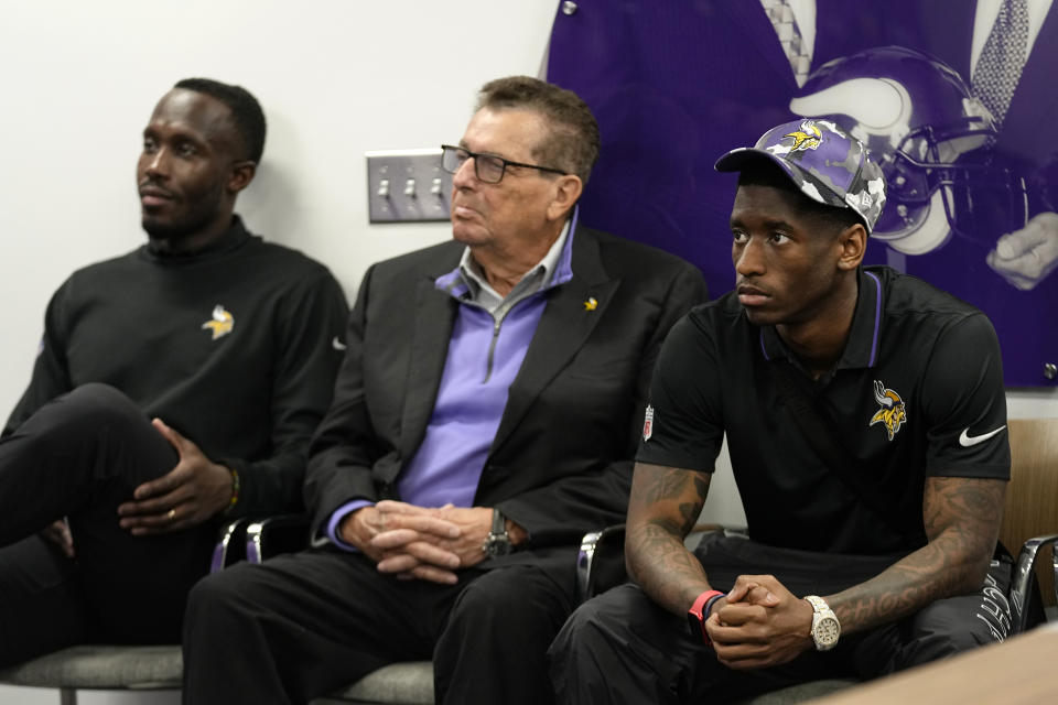 Minnesota Vikings general manager Kwesi Adofo-Mensah, left, owner Leonard Wilf, center, and first-round draft pick Jordan Addison sit as head coach Kevin O'Connell speaks to the media during an NFL football press conference in Eagan, Minn., Friday, April 28, 2023. (AP Photo/Abbie Parr)