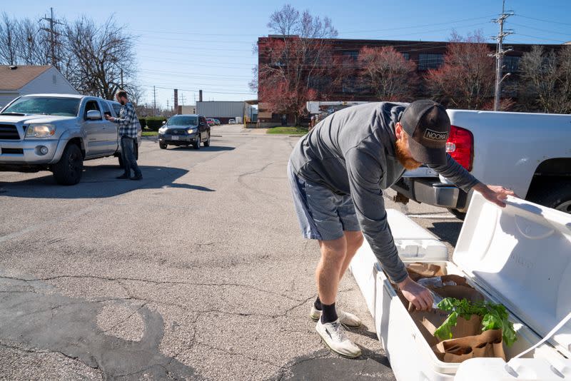 Tim Kelly and Jimmy Myers stock product at one of four pickup spots in Madison Park