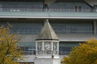 The grandstand at the shuttered Arlington International Racecourse is seen from parking lot in Arlington Heights, Ill., Friday, Oct. 14, 2022. The Chicago Bears want to turn the Arlington Heights site, once a jewel of thoroughbred racing, into a different kind of gem, anchored by an enclosed stadium and bursting with year-round activity — assuming a deal with Churchill Downs Inc. to buy the land goes through. (AP Photo/Nam Y. Huh)