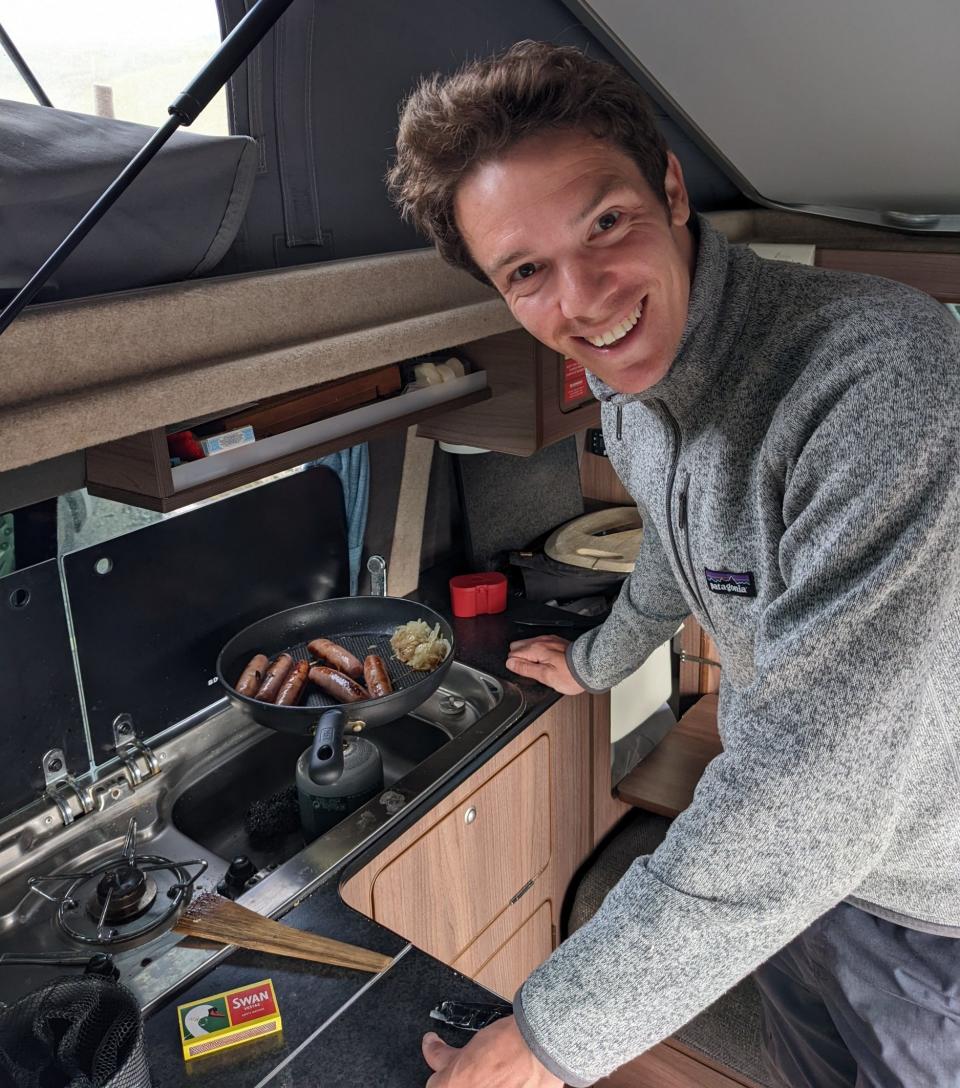 James Warner-Smith Hipcamp James cooks in the caravan