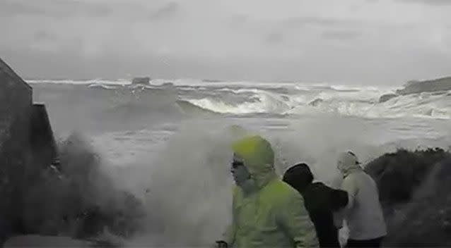 The elderly couple and tourist Olivier Lou were walking back from the beach when a freak wave caught them. Photo: Youtube/Olivier Lou