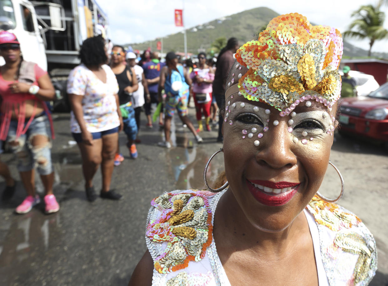 PHILIPSBURG, SINT MAARTEN: A masquerader dances behind music trucks during the j'ouvert street parade as part of the 47th annual Carnival in St Maarten on April 27, 2016 in Philipsburg, St Maarten.  (Photo by Sean Drakes/LatinContent via Getty Images)