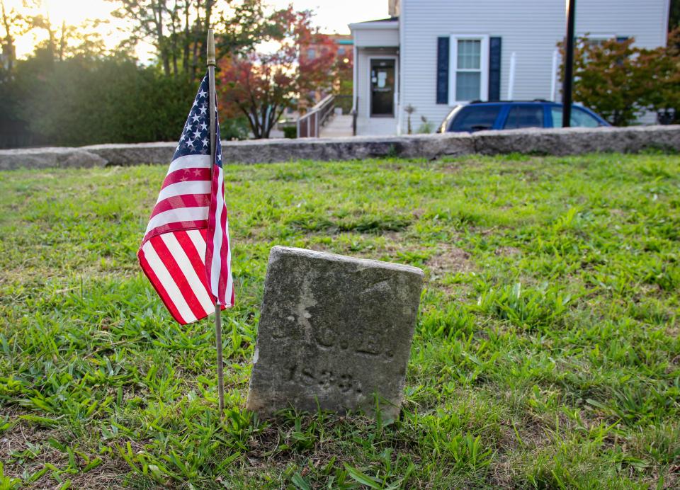 A gravestone stands in Bowen-Borden Cemetery on Purchase Street in Fall River.