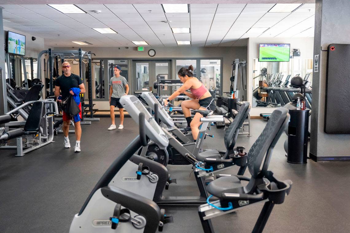 People work out in the fitness center at Grit City Wellness on Friday, July 22, 2022, in Tacoma, Wash.