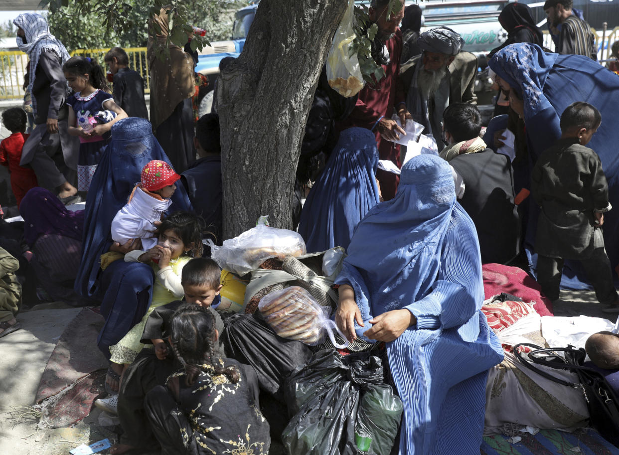 Internally displaced Afghans who fled their home due to fighting between the Taliban and Afghan security personnel, from north provinces are seen at a public park in Kabul, Afghanistan, Monday, Aug. 9, 2021. (AP Photo/Rahmat Gul)
