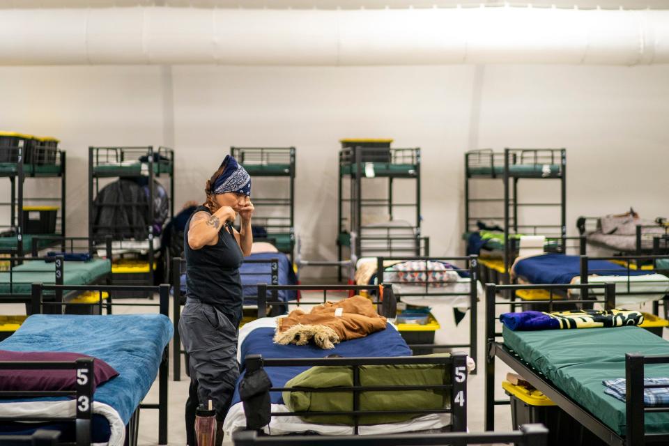 Sheila Morton, of Texas, spends time inside the Respiro structure at Human Services Campus on Saturday, June 4, 2022, in Phoenix. The structure offers unhoused residents an enclosed air-conditioned area with a hundred beds.