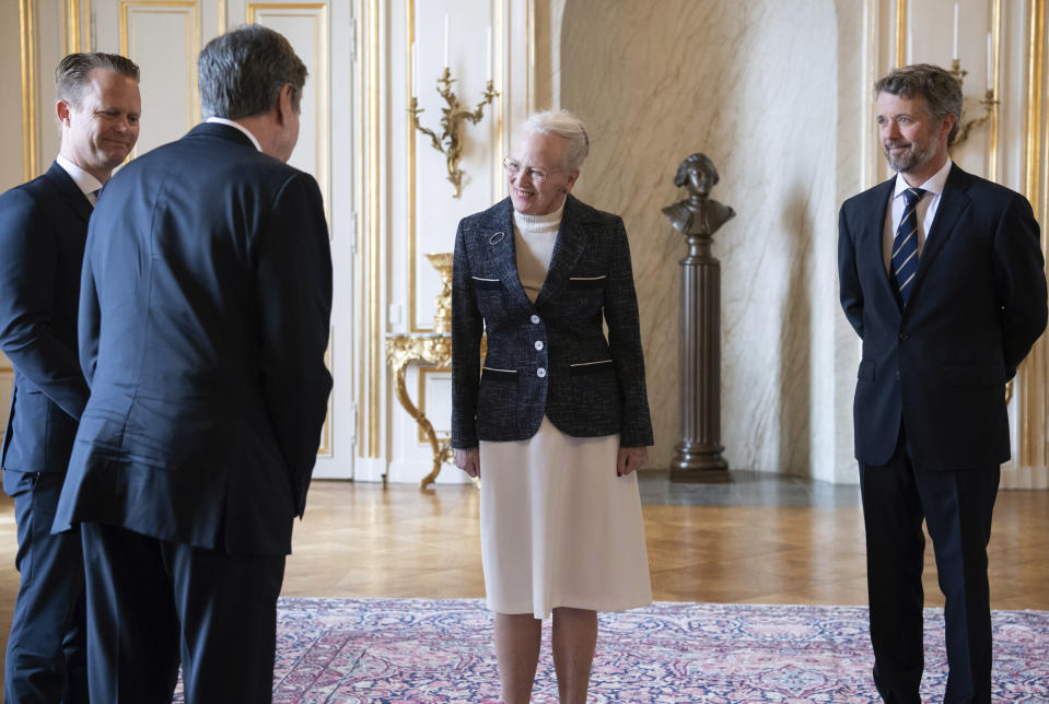 Denmark's Queen Margrethe II, left and Crown Prince Frederik, right, welcome US Secretary of State Antony Blinken, foreground, at Amalienborg Palace in Copenhagen, Denmark, Monday, May 17, 2021. Blinken is seeing Danish leaders as well as top officials from Greenland and the Faeroe Islands in Copenhagen on Monday before he heads to Iceland for an Arctic Council meeting that will be marked by his first face-to-face talks with Russian Foreign Minister Sergey Lavrov at a time of significantly heightened tensions between Washington and Moscow. (Saul Loeb/Pool Photo via AP)