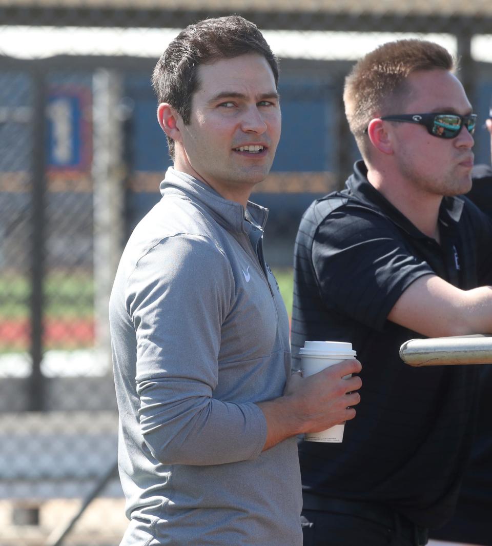 Tigers president of baseball operations Scott Harris watches batting practice during spring training on Monday, Feb. 20, 2023, in Lakeland, Florida.