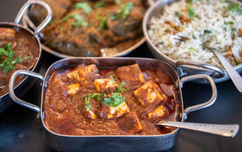 A plate of paneer butter masala, front, is displayed with other freshly made dishes in Nagpuri Saoji restaurant in Voorhees.  Nagpuri Saoji is the only restaurant in the United States that serves Saoji cuisine.  Saoji is a cuisine invented by the weaver community of Nagpur, a city in the central Indian state of Maharashtra.  