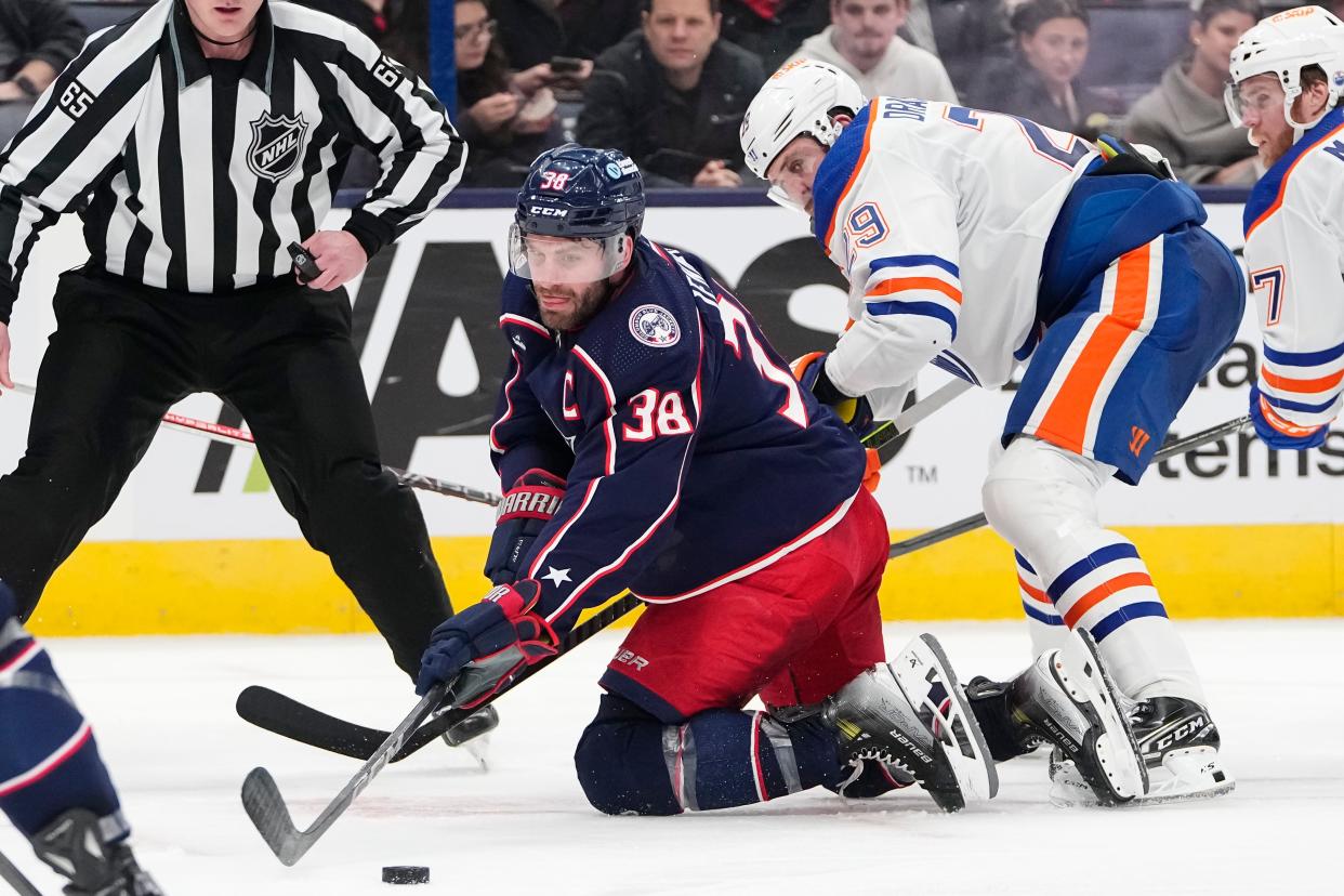Mar 7, 2024; Columbus, Ohio, USA; Columbus Blue Jackets center Boone Jenner (38) wins a face off against Edmonton Oilers center Leon Draisaitl (29) during the second period of the NHL hockey game at Nationwide Arena.