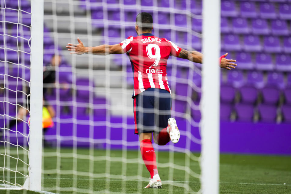 Atletico Madrid's Luis Suarez celebrates after scoring his side's second goal during the Spanish La Liga soccer match between Atletico Madrid and Valladolid at the Jose Zorrilla stadium in Valladolid, Spain, Saturday, May 22, 2021. (AP Photo/Manu Fernandez)