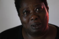 Charity Oriakhi, widow of a street vendor Alika Ogochukwu, cries during an interview with Associated Press at her home in San Severino Marche, Italy, Friday, Aug. 5, 2022. The brutal killing of a Nigerian immigrant in broad daylight has sparked a debate in this well-to-do Adriatic beach community over whether the attack by an Italian man with a court-documented history of mental illness was racially motivated. It will go to the streets on Saturday, Aug. 6 when a Black Italian activists from all over Italy march through the town demanding justice for Alika Ogorchukwu. (AP Photo/Antonio Calanni)