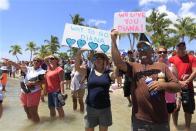 Jen DeMaria (L) and Harry Appel (R) await U.S. long-distance swimmer Diana Nyad, 64, who completed her swim from Cuba to Key West, Florida, September 2, 2013. REUTERS/Andrew Innerarity