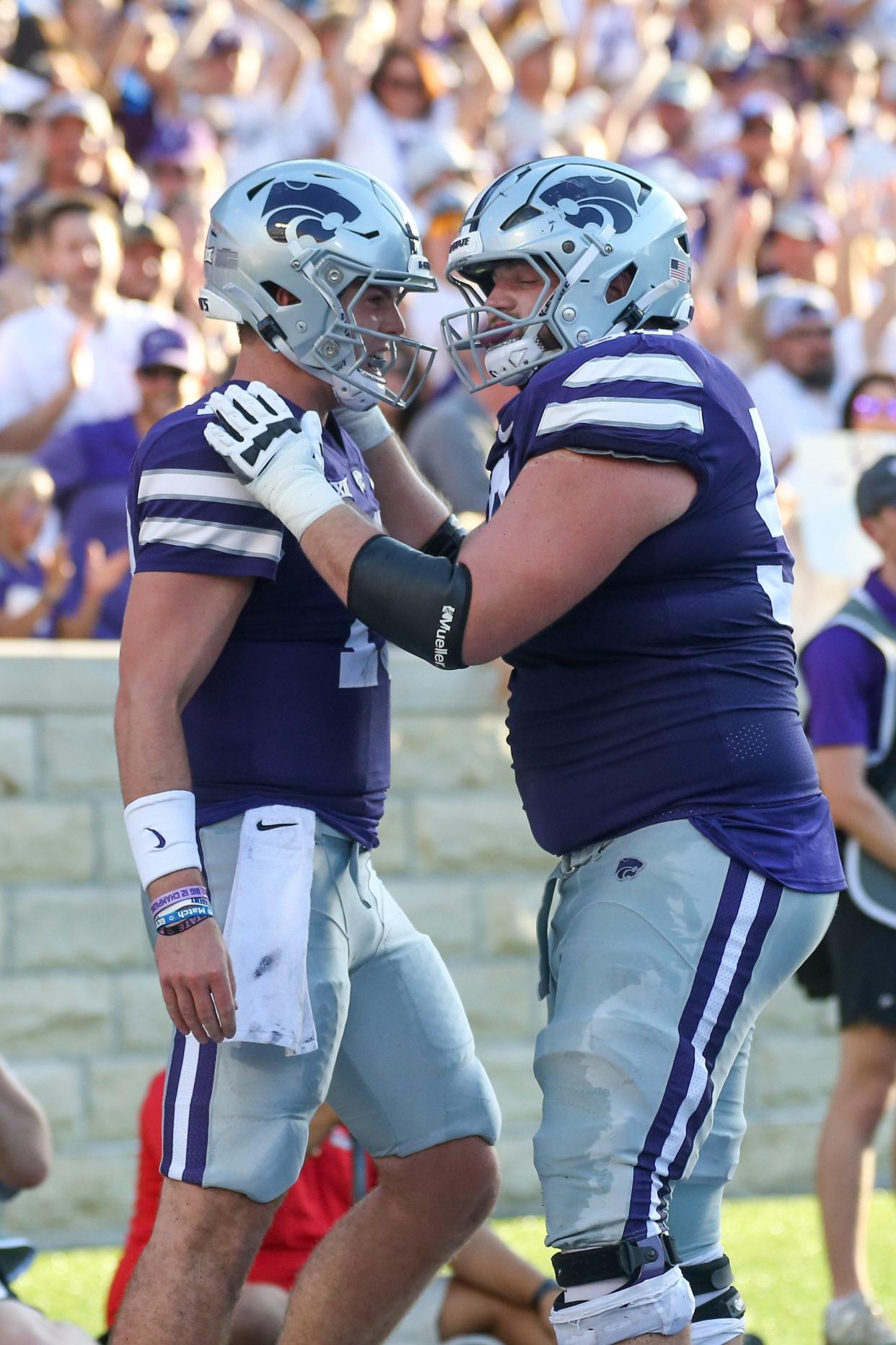 Sep 2, 2023; Manhattan, Kansas, USA; Kansas State Wildcats offensive lineman Cooper Beebe (50) congratulates quarterback Will Howard (18) following a touchdown in the second quarter against the Southeast Missouri State Redhawks at Bill Snyder Family Football Stadium. Mandatory Credit: Scott Sewell-USA TODAY Sports