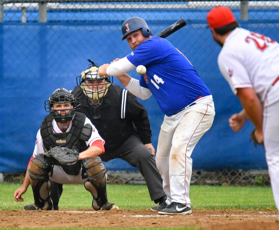 Ben Alvord of the St. Joseph Joes concentrates on a pitch during a Sauk Valley League playoff game against the Rogers Red Devils Saturday, July 23, 2022, in St. Joseph. 