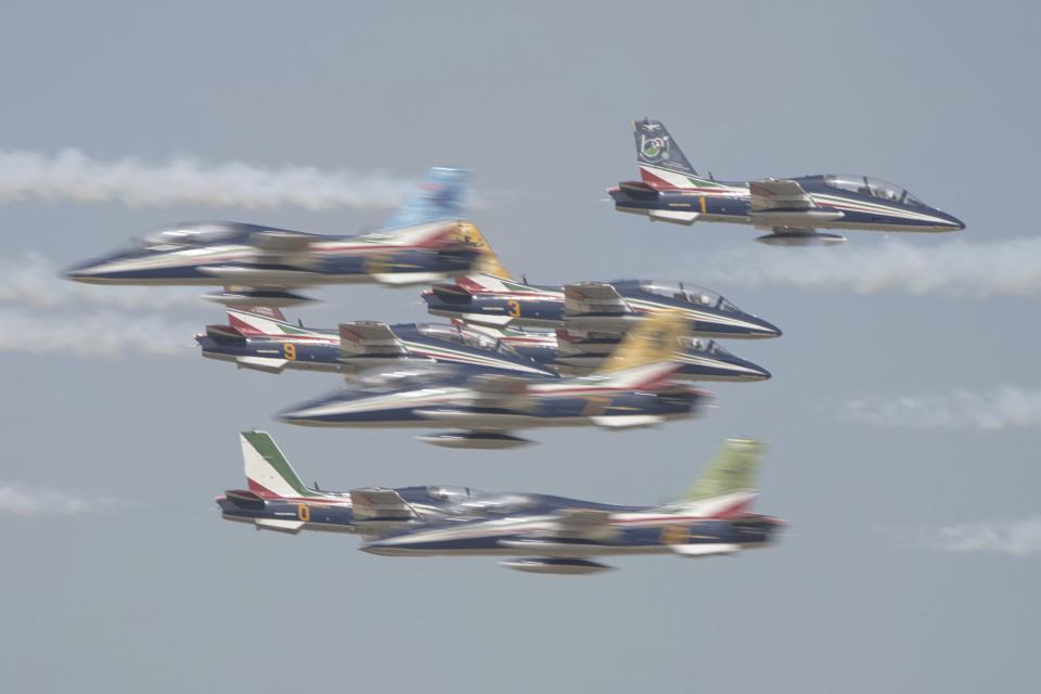 Aircraft from the Italian air force's Frecce Tricolori fly at the Dubai Air Show in Dubai, United Arab Emirates, Wednesday, Nov. 15, 2023. (AP Photo/Jon Gambrell)