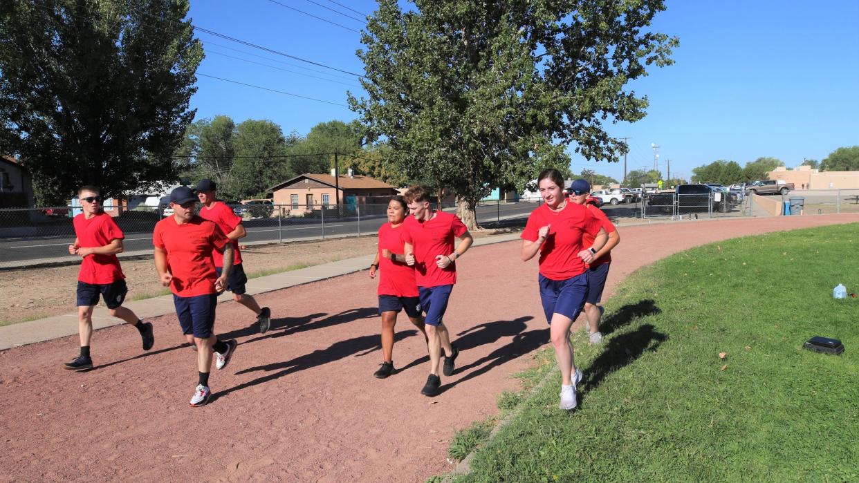 Students in the San Juan College fire science program take a run around the track on Aug. 24, 2021, at the old Tibbetts Middle School property, the planned site of an all-abilities park.