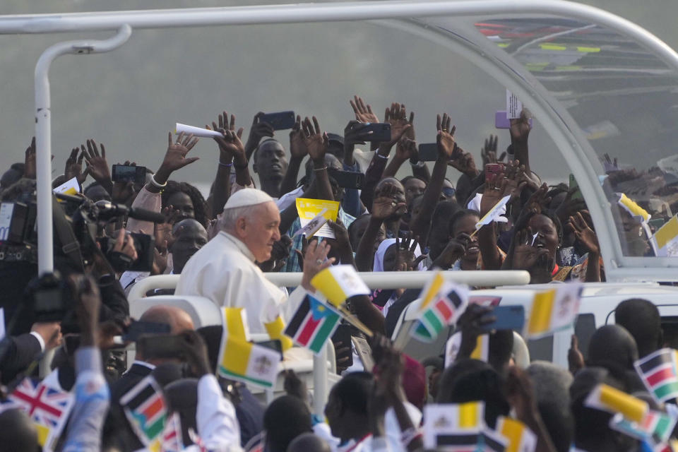 Pope Francis arrives to celebrate mass at the John Garang Mausoleum in Juba, South Sudan, Sunday, Feb. 5, 2023. Francis is in South Sudan on the second leg of a six-day trip that started in Congo, hoping to bring comfort and encouragement to two countries that have been riven by poverty, conflicts and what he calls a "colonialist mentality" that has exploited Africa for centuries. (AP Photo/Gregorio Borgia)