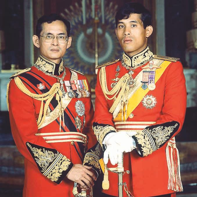 King Bhumibol Adulyadej with his son Crown Prince Maha Vajiralongkorn in full Guards uniform in The Throne Room of the Grand Palace, Bangkok, Thailand 1979 - Rex 