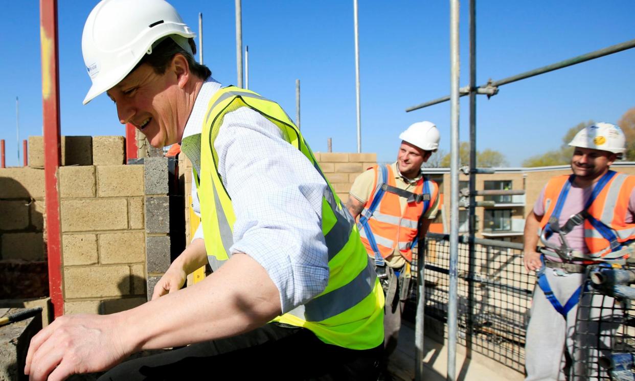 <span>‘The Conservative party had already foisted thousands of new houses on rural areas.’ David Cameron on a visit to a housing development in 2015.</span><span>Photograph: Jonathan Brady/PA</span>