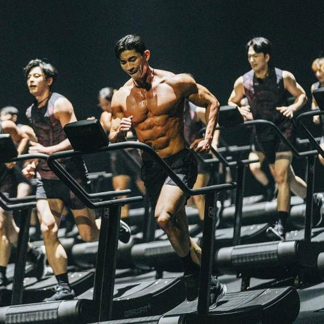  A group of contestants on physical 100 season 2 run on manual treadmills. 