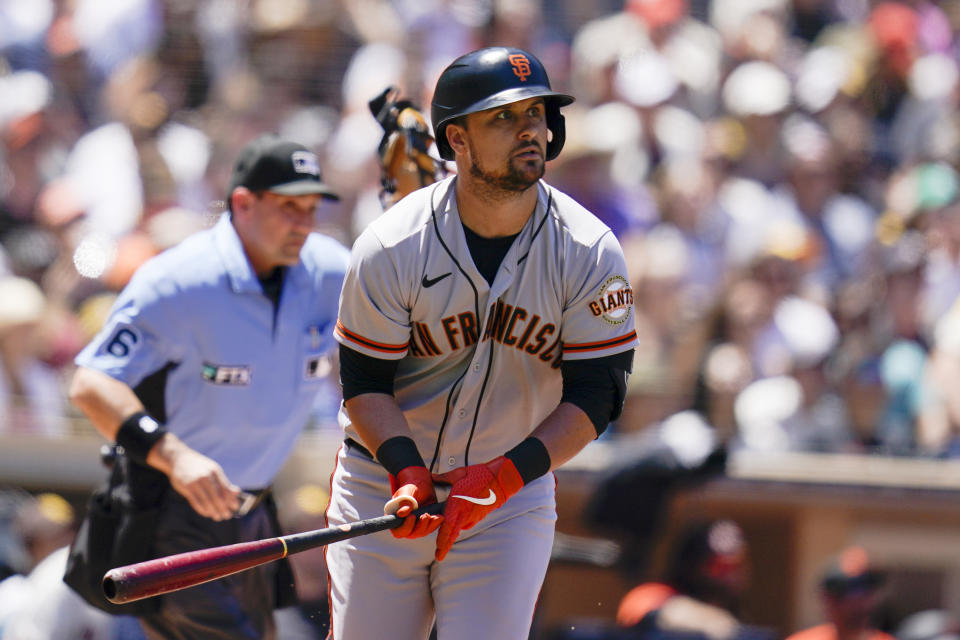 San Francisco Giants' J.D. Davis watches his home run hit during the second inning of a baseball game against the San Diego Padres, Wednesday, Aug. 10, 2022, in San Diego. (AP Photo/Gregory Bull)