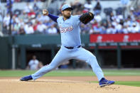 Texas Rangers pitcher Dane Dunning delivers in the first inning of a baseball game against the Houston Astros, Sunday, April 7, 2024, in Arlington, Texas. (AP Photo/ Richard W. Rodriguez)