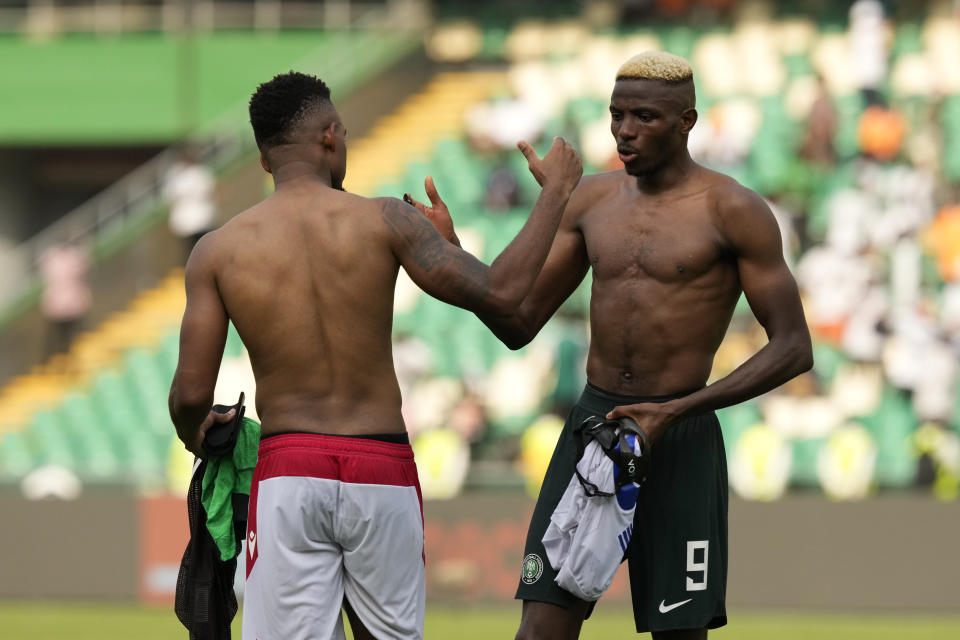 Nigeria's Victor Osimhen, right, shakes hand with Equatorial Guinea's players at the end of the African Cup of Nations Group A soccer match between Nigeria and Equatorial Guinea's in Abidjan, Ivory Coast, Sunday, Jan. 14, 2024. (AP Photo/Sunday Alamba)