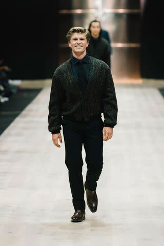 <p>Naomi Rahim/WireImage</p> Robert Irwin walks his first catwalk at the Suit Up Runway show