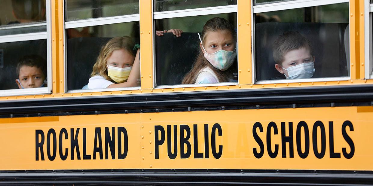 Students arrive at the Jefferson School in Rockland wearing masks on the first day of classes.