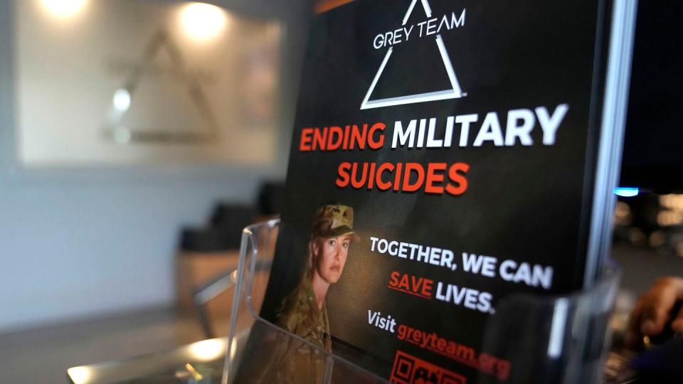 A placard about military suicides is displayed at the Grey Team veterans center, Thursday, May 11, 2023, in Boca Raton, Fla. The center is helping veterans with post-traumatic stress disorder and other mental and physical ailments get back into the civilian world. (AP Photo/Lynne Sladky)