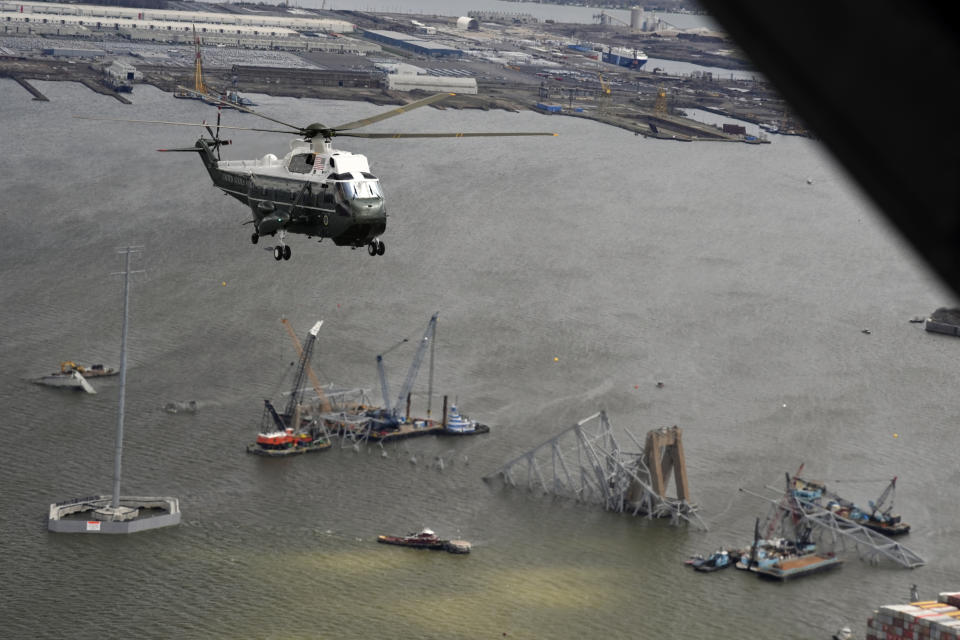 President Joe Biden, aboard Marine One, takes an aerial tour of the collapsed Francis Scott Key Bridge in Baltimore, Friday, April 5, 2024, as seen from an accompanying aircraft. (AP Photo/Manuel Balce Ceneta)