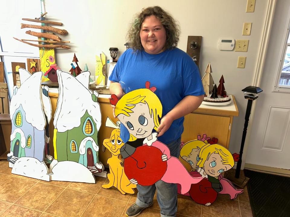 Christine Cheverie shows off some of the characters from 'How the Grinch Stole Christmas' she has made.