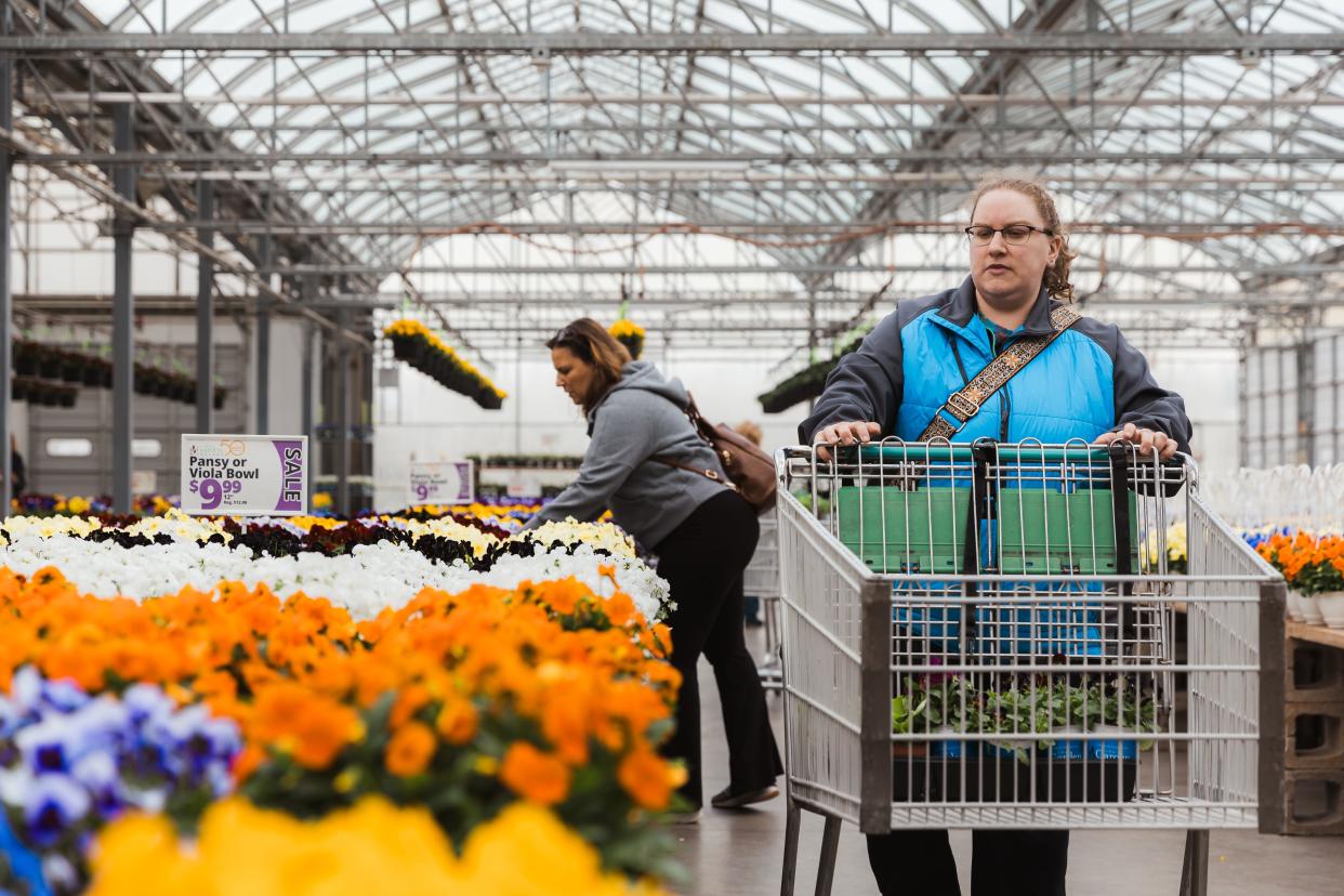 Maddie Sauers picked up butter lettuce for her garden and chose several flowers for her porch planters. She mentioned that the local deer and rabbits are so plentiful that keeping plants outside her home is a challenge.