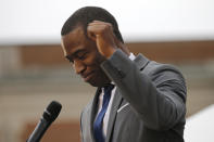 Richmond Mayor Levar Stoney, gestures as he delivers remarks during the unveiling ceremony for a statue titled Rumor's of War by artist Kehinde Wiley at the Virginia Museum of Dine Arts in Richmond, Va., Tuesday, Dec. 10, 2019. The monumental bronze sculpture of a young black man astride a galloping horse was unveiled Tuesday, set to be permanently installed in Virginia's capital city, not far from the Confederate monument it mimics. (AP Photo/Steve Helber)