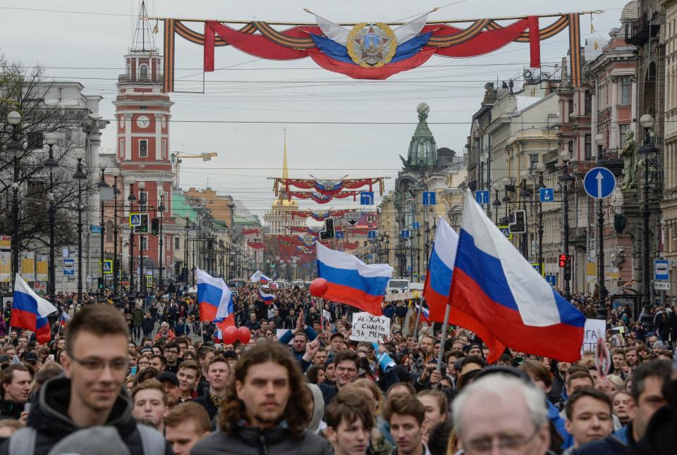 <p>Opposition supporters attend an unauthorized anti-Putin rally called by opposition leader Alexei Navalny on May 5, 2018 in Saint Petersburg, two days ahead of Vladimir Putin’s inauguration for a fourth Kremlin term. (Photo: Olga Maltseva/AFP/Getty Images) </p>