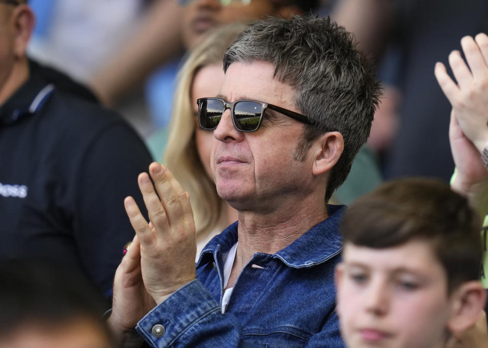 Manchester musician Noel Gallagher applauds during the English Premier League soccer match between Fulham and Manchester City at the Craven Cottage Stadium in London, Saturday, May 11, 2024. (AP Photo/Kirsty Wigglesworth)