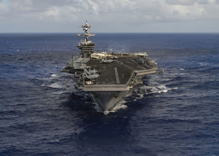 FILE PHOTO - The aircraft carrier USS Carl Vinson (CVN 70) transits the Pacific Ocean January 30, 2017. U.S. Navy Photo by Mass Communication Specialist 3rd Class Tom Tonthat/Handout via Reuters/File Photo