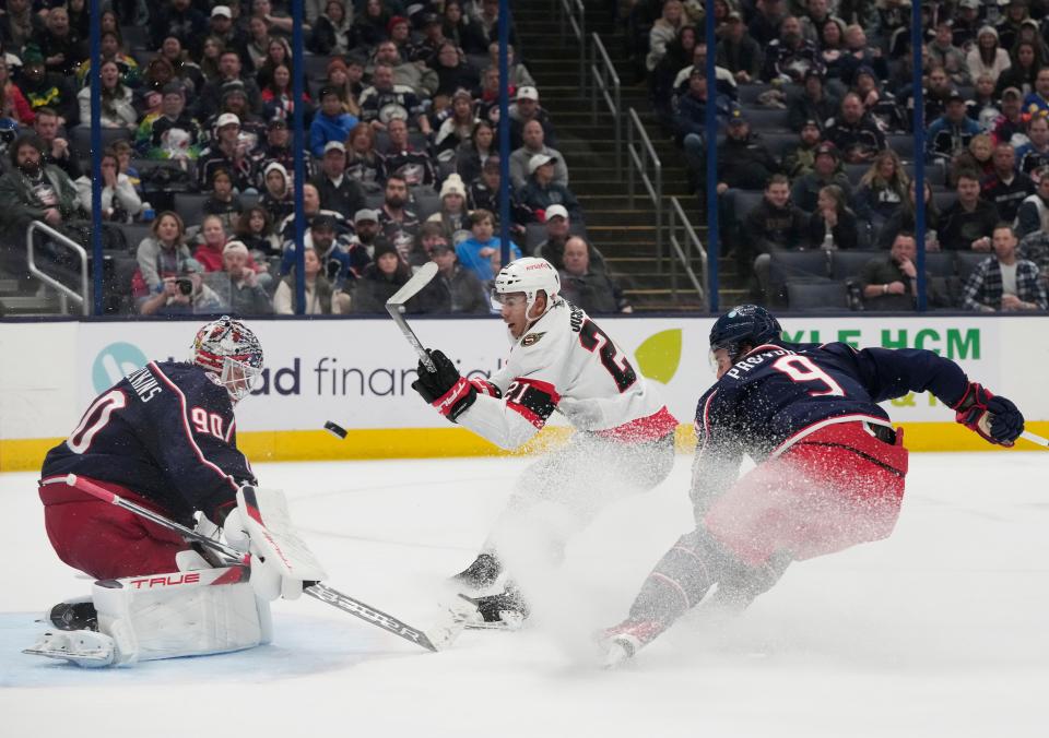 Dec. 1, 2023; Columbus, Ohio, USA; 
Columbus Blue Jackets goaltender Elvis Merzlikins (90) saves a shot on goal by Ottawa Senators right wing Mathieu Joseph (21) during the second period of FridayÕs hockey game at Nationwide Arena.