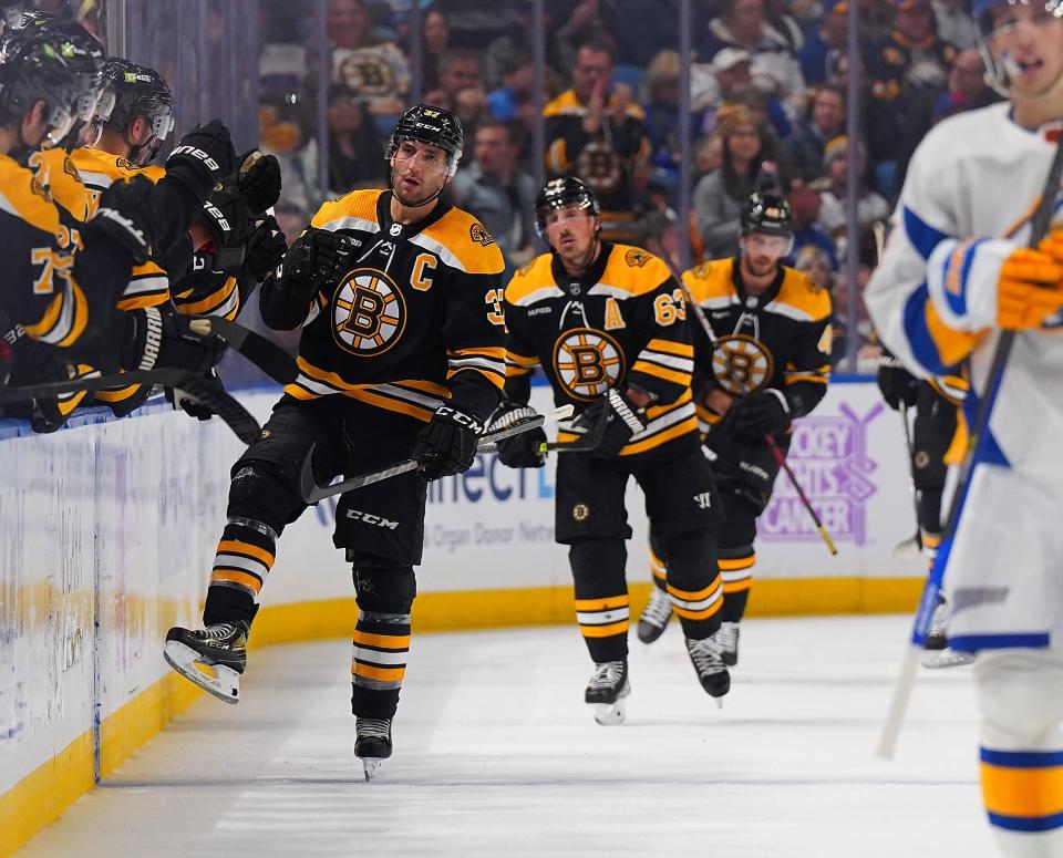 BUFFALO, NY - NOVEMBER 12: Patrice Bergeron #37 of the Boston Bruins celebrates a power play goal during the second period against the Buffalo Sabres at KeyBank Center on November 12, 2022 in Buffalo, New York. (Photo by Kevin Hoffman/Getty Images)