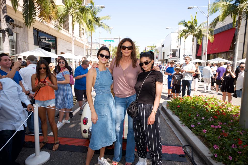 Kendall Jenner, Caitlyn Jenner and Kylie Jenner pose for a photo as Caitlyn Jenner displays her Austin-Healey Sprite at the Rodeo Drive Concours d'Elegance on June 18, 2017 in Beverly Hills, California. (Photo by Earl Gibson III/Getty Images)